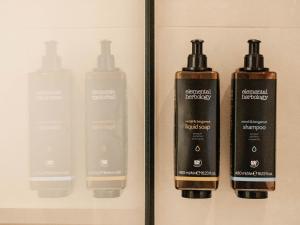 a group of four products on a shelf at Fora Hotel Hannover by Mercure in Hannover