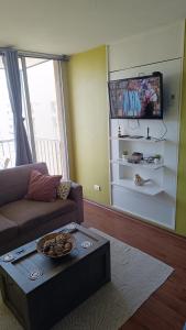 TV a/nebo společenská místnost v ubytování Departamento 1 dormitorio 1 baño cercano al aeropuerto + 9 fotografií