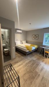 a bedroom with a large bed in a room at Villa Piazzetta in Bacău