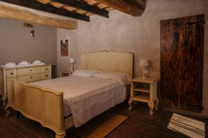 Postel nebo postele na pokoji v ubytování Agriturismo Albero del Latte