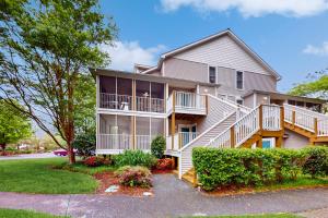 a large house with balconies and trees at Sea Colony - 56119 Cypress Lake Cir in Bethany Beach