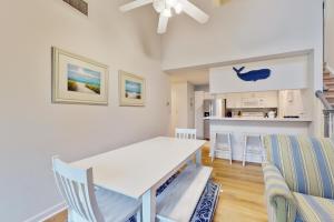 a kitchen and dining room with a white table and chairs at Sea Colony - 56119 Cypress Lake Cir in Bethany Beach