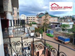 an apartment balcony with a view of a city at BARAN Home in Yaoundé