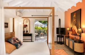 TV a/nebo společenská místnost v ubytování Villa La Créole - Anse Marcel