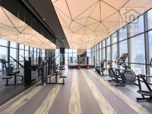 a gym with treadmills and ellipticals in a building at 暹罗百丽宫奢华公寓 Siam Paragon Luxury Stay #W08 in Pratunam