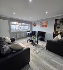 Un lugar para sentarse en FM Homes & Apartments 3 Bedroom House Motherwell