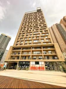 a large tall building with windows in a city at Premium Tranquility in the International Center in Bogotá
