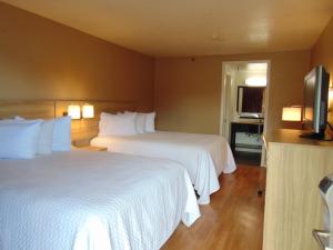 Ένα ή περισσότερα κρεβάτια σε δωμάτιο στο Days Inn by Wyndham Victorville