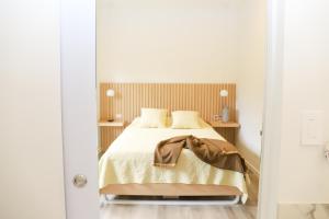 a bedroom with a bed in a white room at Hotel Colina Inn Escazu in San Rafael +68 photos