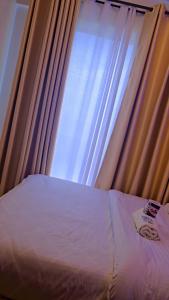 Ένα ή περισσότερα κρεβάτια σε δωμάτιο στο Tsavo