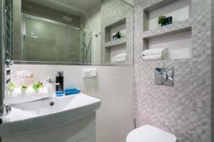 Koupelna v ubytování VIP Apartamenty Centrum + 126 fotografií