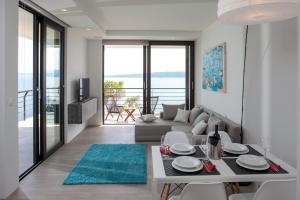 a living room with a couch and a table at Soho Apartments Brela in Brela