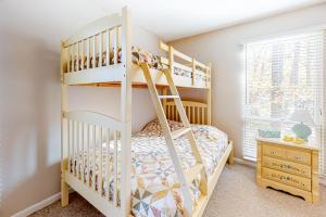 a white bunk bed in a bedroom with a dresser at Sea Colony - 2306 Round Robin Way in Sea Colony +41 photos