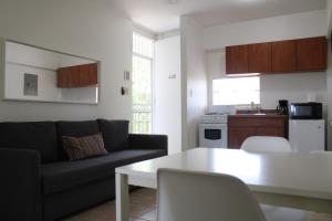 a living room with a couch and a table at Boulevard Park IV 402 in Mayaguez