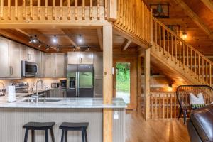 a kitchen with a counter top in a cabin at MountainTime in Vilas