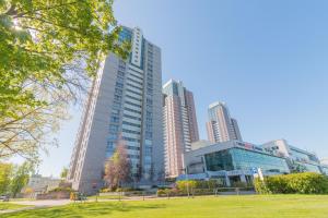 a group of tall buildings in a city at Panorama Sky Apartment near Riga Airport & City Center in Rīga