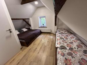 Postel nebo postele na pokoji v ubytování Chata Jizerky