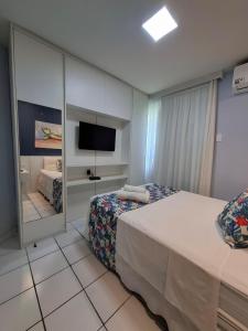 Postel nebo postele na pokoji v ubytování Flat Blue Ponta Negra Beach