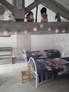 Postel nebo postele na pokoji v ubytování Gîte Le Logis du Tilleul + 18 fotografií