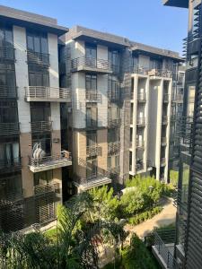 a view of an apartment building from a window at Snow light 2BDR , Madinaty in Madinaty