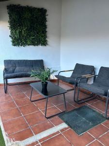 a living room with two couches and a table at La villa de Leo y Lola in Frómista +44 photos