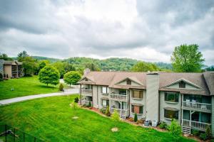 an aerial view of a house with a yard at Chetola: Holly 4 in Blowing Rock