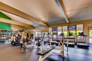 a gym with several treadmills and ellipticals at Pico Village Resort G301 in Killington