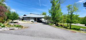 a house with a driveway in front of it at Woods Village 33 in Killington