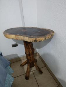 a wooden table in the corner of a room at Habitación en casa familiar in Antigua Guatemala