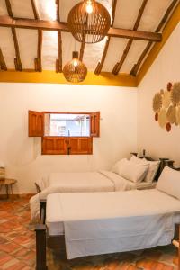 Ένα ή περισσότερα κρεβάτια σε δωμάτιο στο Hotel Boutique Casa Trilo