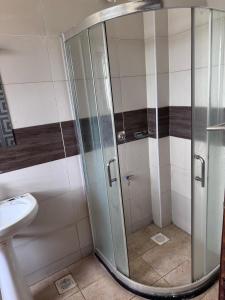 a shower stall in a bathroom with a toilet at Milele Homes- Ruaka View Aprt in Nairobi +17 photos
