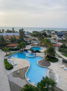 an aerial view of a swimming pool at a resort at Oasis Aruba Views Just for You! -Newly Refurnished in Oranjestad