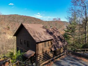 an old house in the middle of the forest at Happy Trees Cabin in Laxon