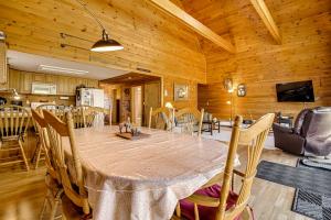 a dining room and kitchen with a table and chairs at Mountain-View Deck! Cabin By Mt Abraham Trails in Kingfield