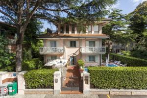 a large house with a pool in front of it at Residenza Villa Lidia in Riccione