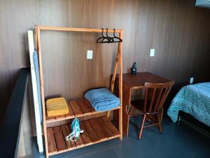 a room with a bunk bed and a desk at Sobrado de Container Azul in Dourados