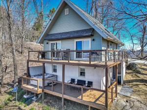 a house with a large deck on a hill at Calling Me Home in Blowing Rock