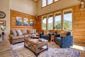a living room with a couch and two chairs and a table at Mountain View Splash - Indoor Pool Hot Tub Game Room Stunning Smoky Mountain Views in Wear Valley +51 photos