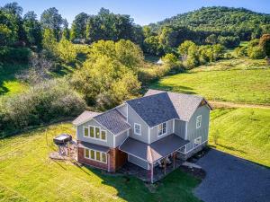 an aerial view of a house with a roof at Mountain View Splash - Indoor Pool Hot Tub Game Room Stunning Smoky Mountain Views in Wear Valley