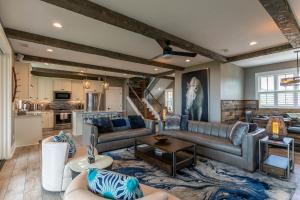 a living room with a couch and a table at Mountain Kandy at Blue Ridge Mountain Club in Stony Fork