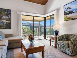 a living room with a couch and a table at Wailea Elua Village 208 in Wailea