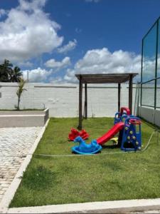 a park with a playground with a play equipment at Casa Delta 187 in Parnaíba