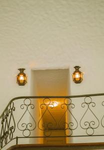 a staircase with two lights and two lights on the wall at CASA ll in Punta del Este