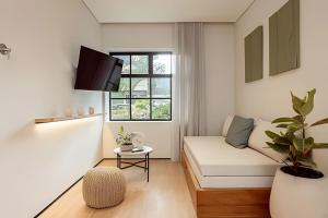 TV a/nebo společenská místnost v ubytování Casa Fiora Oasis