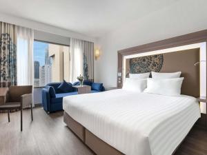 Кровать или кровати в номере Novotel Bangkok on Siam Square