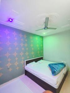 Ένα ή περισσότερα κρεβάτια σε δωμάτιο στο Hotel sagar palace