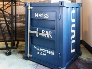 a blue metal box with a bar written on it at Mercure Hotel Hamburg City in Hamburg