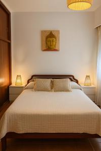 En eller flere senge i et værelse på Edificio Romeo IV