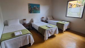 Postel nebo postele na pokoji v ubytování Casa Franco Hospedaria
