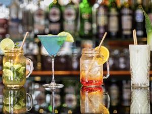 two cocktails in mason jars on a bar at Mercure Lyon Centre Château Perrache in Lyon